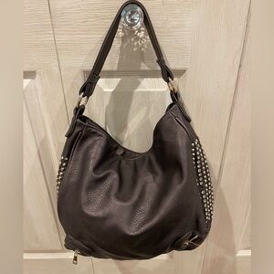 Trendy handbag with rhinestones on side